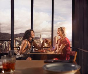 Two women share together a meal. Discover how far Colombia has reached in its LGBT history