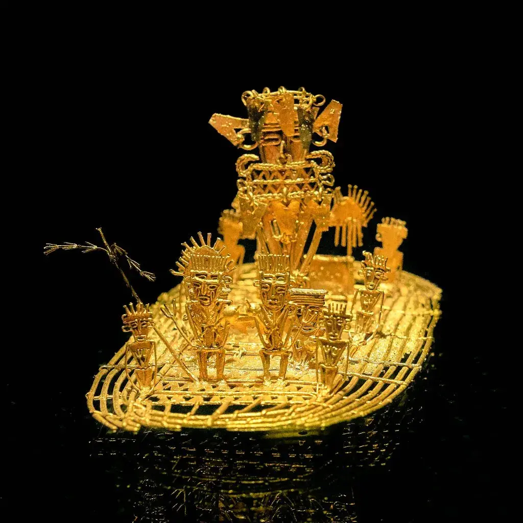 Balsa Muisca de oro sobre fondo negro.