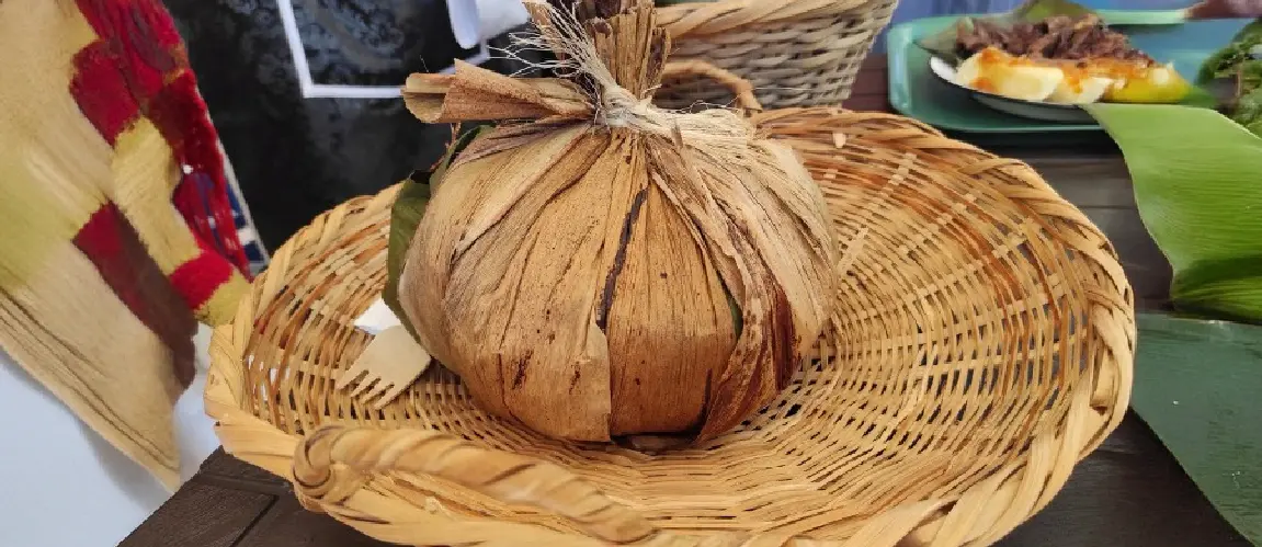 Fresh coconut wrapped in woven palm leaves on an artisan basket in a traditional market