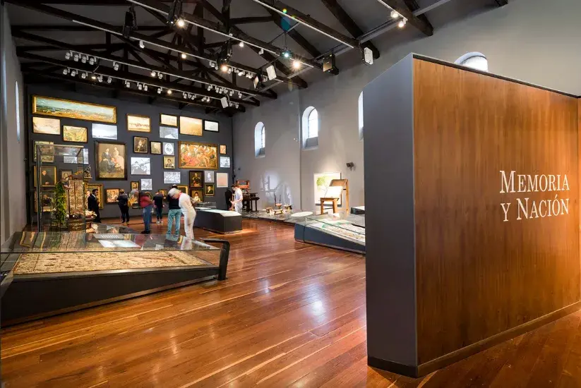 Museum interior with wooden floor and gray walls — Courtesy: Visit Bogotá