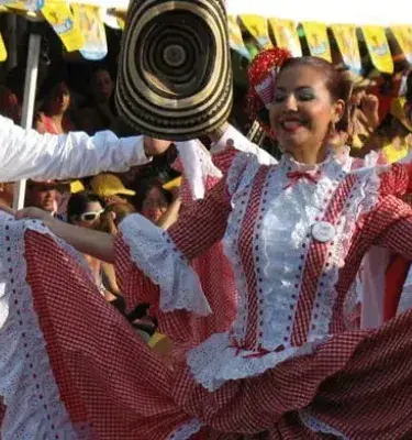 Dancers in red and white costumes at the Barranquilla Carnival