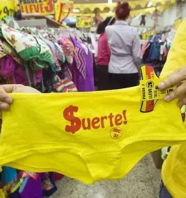 Yellow pantyhose with the word luck in red letters