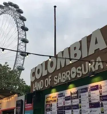 Sign for the “Colombia Land of Sabrosura” event featuring the London Eye Ferris wheel.