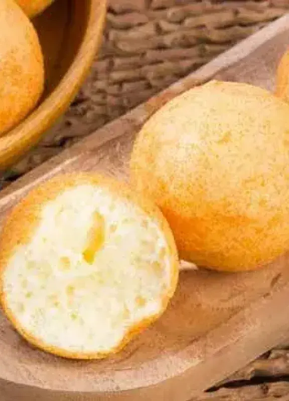 Colombian fried and browned fritters, one cut in half