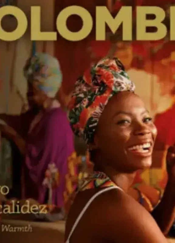 Cover of the book Colombia: The book of warmth with smiling Afro-Colombian woman.