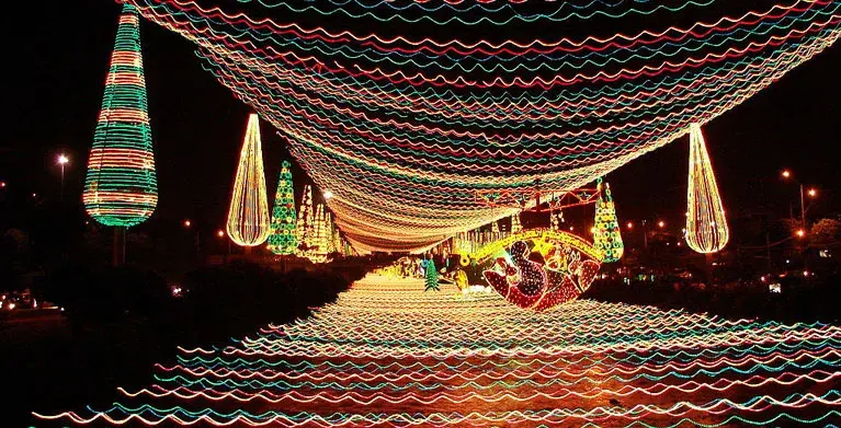 Colorful Christmas lights decorating the river and surroundings in Medellín, Colombia