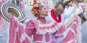 Dancers in red and white costumes at the Barranquilla Carnival.