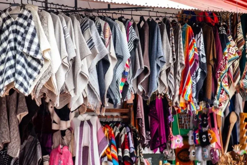 Different styles of ruanas hanging